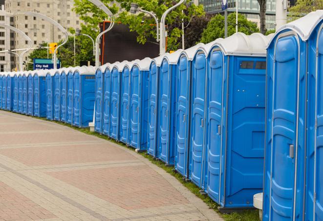 a line of portable restrooms set up for a wedding or special event, ensuring guests have access to comfortable and clean facilities throughout the duration of the celebration in Clearwater Beach, FL